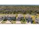 Aerial view of suburban homes next to a canal at 3148 Marine Grass Dr, Wimauma, FL 33598