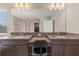 Bathroom featuring dual sinks with granite countertops and a large mirror at 3148 Marine Grass Dr, Wimauma, FL 33598
