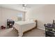 Comfortable bedroom with a neutral color scheme, simple furnishings, and good natural light at 3148 Marine Grass Dr, Wimauma, FL 33598