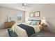 Well-lit bedroom features plush bedding, stylish decor, and ample natural light at 3148 Marine Grass Dr, Wimauma, FL 33598