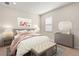 Comfortable bedroom with stylish furniture and soft, neutral tones at 3148 Marine Grass Dr, Wimauma, FL 33598