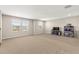 Spacious bonus room with abundant natural light, ideal for entertainment, recreation, or as a versatile living area at 3148 Marine Grass Dr, Wimauma, FL 33598