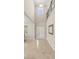 Bright foyer featuring high ceilings, tiled floors, a decorative window, and a white front door at 3148 Marine Grass Dr, Wimauma, FL 33598