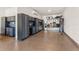 Organized garage featuring epoxy floors, custom cabinets, workbenches, and shelving units at 3148 Marine Grass Dr, Wimauma, FL 33598