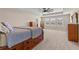 The primary bedroom is open and airy, with a ceiling fan and lots of natural light at 3148 Marine Grass Dr, Wimauma, FL 33598