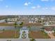 Aerial view of the home and surrounding neighborhood with waterfront properties and canal access at 3415 Croaker Dr, Hernando Beach, FL 34607
