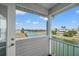 Balcony overlooking waterfront with houses in view at 3415 Croaker Dr, Hernando Beach, FL 34607