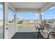 Inviting balcony with comfortable seating and a picturesque view of the serene water and neighborhood at 3415 Croaker Dr, Hernando Beach, FL 34607