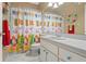 Bright bathroom with white vanity, and colorful shower curtain and accents at 3415 Croaker Dr, Hernando Beach, FL 34607
