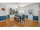 A dining room with wood floors and seating for six at 3415 Croaker Dr, Hernando Beach, FL 34607