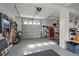 Spacious two-car garage with tools, equipment, and ample storage space at 3415 Croaker Dr, Hernando Beach, FL 34607