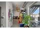Garage with storage racks, various tools, a plant, and access to the outdoor patio at 3415 Croaker Dr, Hernando Beach, FL 34607