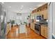 Bright kitchen with stainless steel appliances, hardwood floors, and a center island at 3415 Croaker Dr, Hernando Beach, FL 34607
