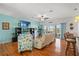 Bright living room with hardwood floors and sliding glass doors opening to a waterfront view at 3415 Croaker Dr, Hernando Beach, FL 34607
