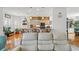 Open concept living room and kitchen featuring hardwood floors and views at 3415 Croaker Dr, Hernando Beach, FL 34607