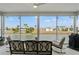 Relax on this screened patio with comfortable seating and enjoy the serene waterfront view at 3415 Croaker Dr, Hernando Beach, FL 34607