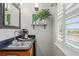 Wet bar featuring stone countertops, shelving, decor, stainless steel sink, and bright light at 3415 Croaker Dr, Hernando Beach, FL 34607