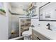 Bathroom with a modern shower with decorative tile and a rustic vanity at 3503 Plaza Ave, Spring Hill, FL 34608