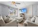 Bright and airy living room showcasing modern decor, natural light, and comfortable seating at 3503 Plaza Ave, Spring Hill, FL 34608