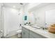 Bright bathroom with double vanity, granite countertop, and tub/shower combo at 38602 Finn Clover Ln, Zephyrhills, FL 33540