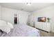 Comfortable bedroom with walk-in closet, dresser, and a serene atmosphere at 38602 Finn Clover Ln, Zephyrhills, FL 33540