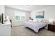 Cozy bedroom with neutral tones, plush carpeting, and natural light at 38602 Finn Clover Ln, Zephyrhills, FL 33540