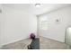 Bright bedroom with exercise ball, yoga mat, dumbells, and neutral carpet at 38602 Finn Clover Ln, Zephyrhills, FL 33540