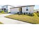 A inviting single-Gathering home with a well-kept lawn and an attached two-car garage at 38602 Finn Clover Ln, Zephyrhills, FL 33540
