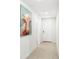 Bright hallway featuring wood-look tile flooring and neutral walls at 38602 Finn Clover Ln, Zephyrhills, FL 33540