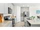 Bright kitchen featuring light cabinets, granite countertops, and stainless steel appliances at 38602 Finn Clover Ln, Zephyrhills, FL 33540