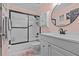 Clean bathroom with a shower-tub combo and a modern white vanity at 39650 Us Highway 19 N # 244, Tarpon Springs, FL 34689