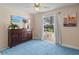 Comfortable bedroom with a large window, neutral walls, and a wood dresser at 39650 Us Highway 19 N # 244, Tarpon Springs, FL 34689