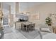 Open-concept dining area leading to a kitchen featuring modern decor and plenty of natural light at 39650 Us Highway 19 N # 244, Tarpon Springs, FL 34689