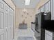 Bright kitchen with stainless steel appliances, modern cabinets, tile flooring and large pantry/closet at 39650 Us Highway 19 N # 244, Tarpon Springs, FL 34689