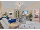 Comfortable living room features neutral tones, large windows, and modern furnishings at 39650 Us Highway 19 N # 244, Tarpon Springs, FL 34689