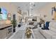 Bright open living room with high ceilings, modern decor and stylish furnishings at 39650 Us Highway 19 N # 244, Tarpon Springs, FL 34689