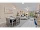 Stylishly decorated living area with elegant dining set and plush seating, bathed in natural light at 39650 Us Highway 19 N # 244, Tarpon Springs, FL 34689