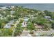 Aerial view showcasing the home's proximity to the water and lush green surroundings at 400 5Th S Ave, Safety Harbor, FL 34695