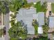 Aerial view highlights the unique roofline and landscaping of this charming residence at 400 5Th S Ave, Safety Harbor, FL 34695