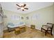 Inviting guest bedroom offering ample natural light, travertine flooring, and comfortable seating at 400 5Th S Ave, Safety Harbor, FL 34695