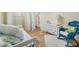 Comfortable bedroom featuring a daybed, walk-in closet, and coastal-themed decor at 400 5Th S Ave, Safety Harbor, FL 34695