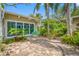 Beautiful courtyard with brickwork, bench and lush landscaping, creating a private outdoor oasis at 400 5Th S Ave, Safety Harbor, FL 34695