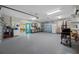 Garage with epoxy flooring, and access to another room with stainless cabinets, sink and countertops at 400 5Th S Ave, Safety Harbor, FL 34695