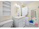 This laundry room features a stackable washer/dryer unit, storage cabinet and a utility sink at 400 5Th S Ave, Safety Harbor, FL 34695