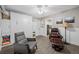 Stylish living room with two armchairs, decorative wall art and a doorway to the kitchen at 400 5Th S Ave, Safety Harbor, FL 34695