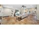 Open-concept living room with travertine tile, seamlessly connecting to the dining and kitchen areas at 400 5Th S Ave, Safety Harbor, FL 34695