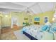 Main bedroom offers a vaulted ceiling, light-green walls and access to ensuite at 400 5Th S Ave, Safety Harbor, FL 34695