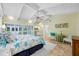 Spacious main bedroom with travertine floors, vaulted ceiling and adjacent mini bar area at 400 5Th S Ave, Safety Harbor, FL 34695