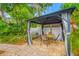 Outdoor patio featuring a shaded gazebo with seating, perfect for relaxing or entertaining at 400 5Th S Ave, Safety Harbor, FL 34695