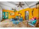 Sunroom with bright decor, comfortable seating, and tile floors at 400 5Th S Ave, Safety Harbor, FL 34695